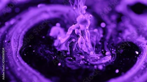 Purple and Black Acrylic Paint Pouring and Swirling into Liquid Vortex, Macro Abstract Fluid Art