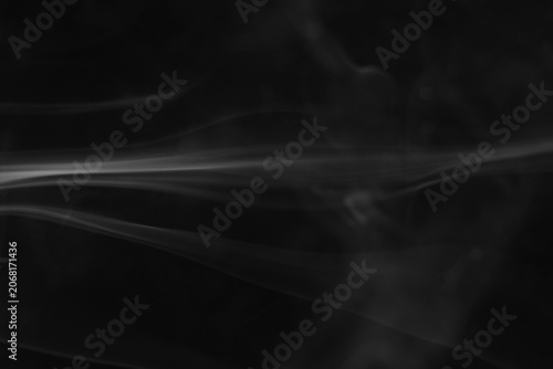 Fotografie Close up of incense smoke in the air