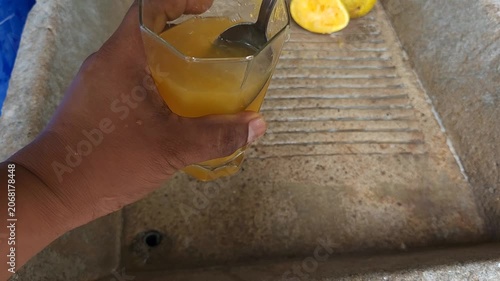 Mixing Freshly Squeezed Orange Juice with Aloe Vera Gel