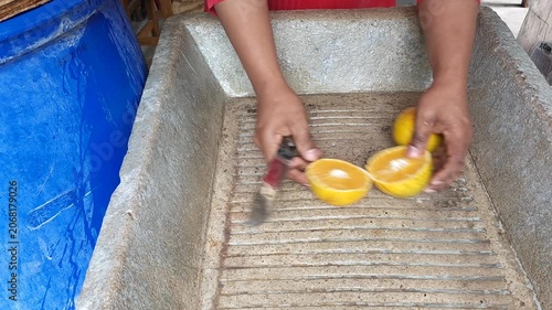 Cutting Organic Oranges Rich in Vitamin C on Cutting Surface
