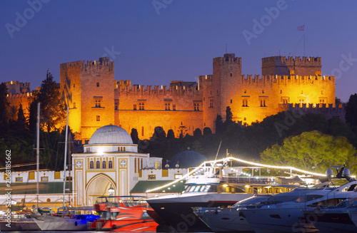 Palace of the Grand Master and Mandraki Harbor at Night in Rhodes Greece