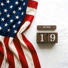 American flag on white background with June 19 wooden calendar blocks