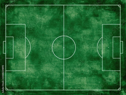 Overhead view of a green soccer field with white chalk lines on a textured surface