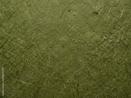 Dark green mulberry paper texture background surface.
