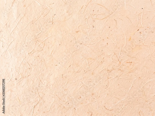 Light beige mulberry paper texture background surface.