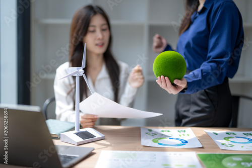 Konstfotografi Businesswomen discussing esg sustainability incorporating green energy solutions