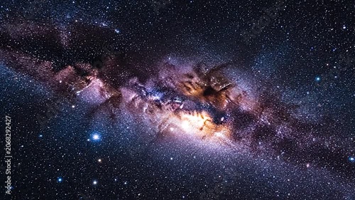 A vibrant spiral glows brightly in the deep dark space
