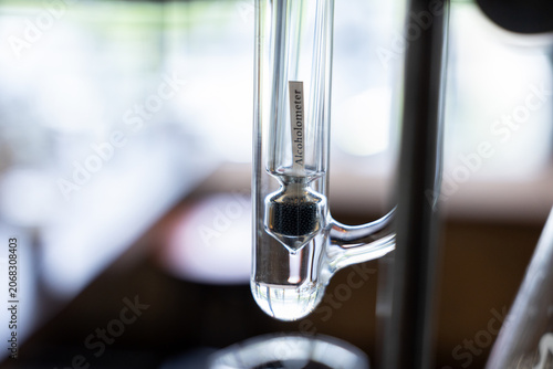 Obraz na plátně Alcoholometer glass laboratory measurement liquid transparent closeup scientific