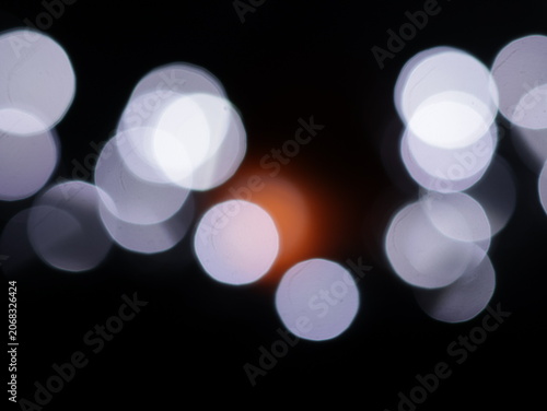 Photos Un fondo abstracto de luces de navidad de diferentes colores en la oscuridad