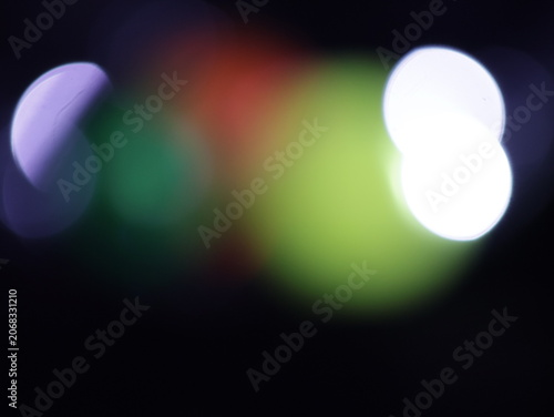 Tableau sur toile Un fondo abstracto de luces de navidad de diferentes colores en la oscuridad