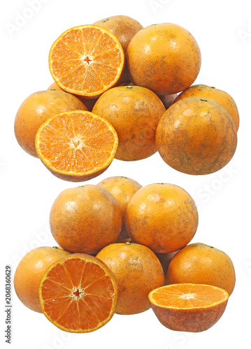 Fresh ripe tangerines and juicy sliced orange halves isolated on white background