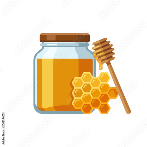 A glass jar of golden honey with a wooden dipper and honeycomb