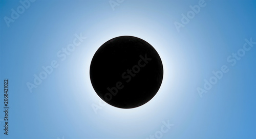 Solar eclipse phenomenon with black sun in blue sky rare astronomical event with corona visible around dark disk natural wonder of celestial alignment