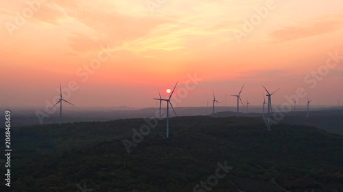 Wind Turbines on Rural Hills at Sunset