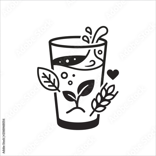 Glass with water and leaves.