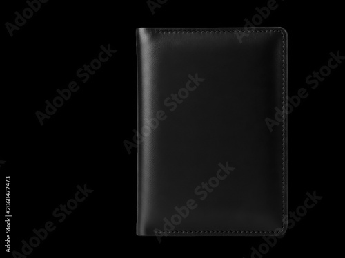 Black leather wallet standing upright on a flat surface