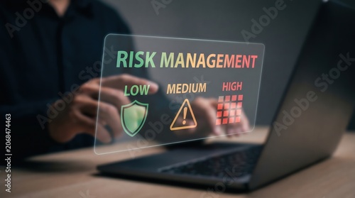 AI Risk Management, Cyber Security Shield, and Compliance Matrix Concept: Glowing Holographic Flat Text Words Low Medium High with Threat Warning Icons and Grid System Over Desk Hands