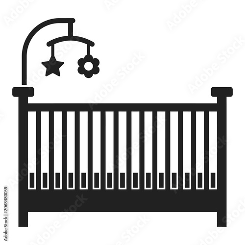 Black silhouette of a baby crib with mobile toy and star flower decoration icon