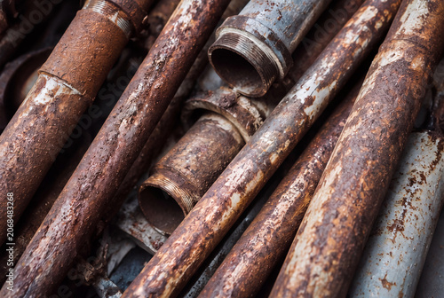 Pile of Rusted Metal Pipes with Severe Corrosion and Decay