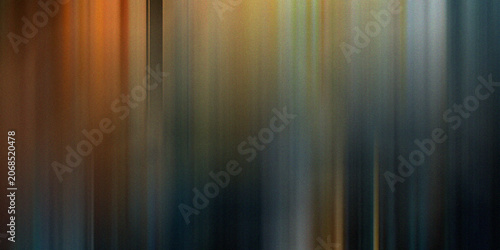 Atmospheric vertical motion blur with dark blue and warm golden tones creating a moody textured background for cinematic design.