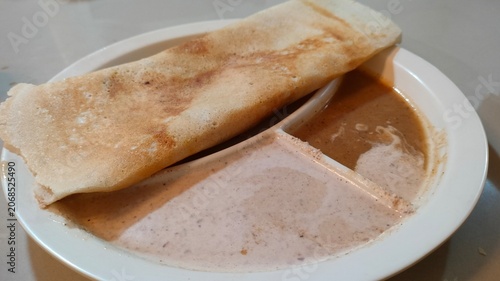 Traditional Masala Dosa Served with Curry Sauce
