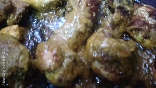 sliced ​​chicken that is being grilled in boiling oil