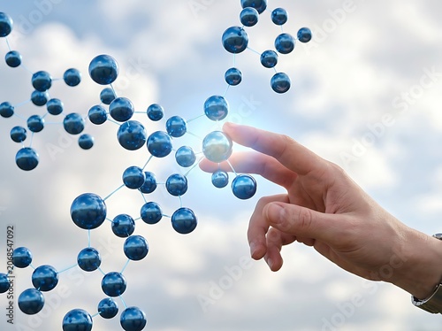 Human hand touching glowing digital data spheres in sky.