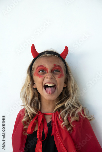 Boy in Devil Costume Making Funny Face at Camera