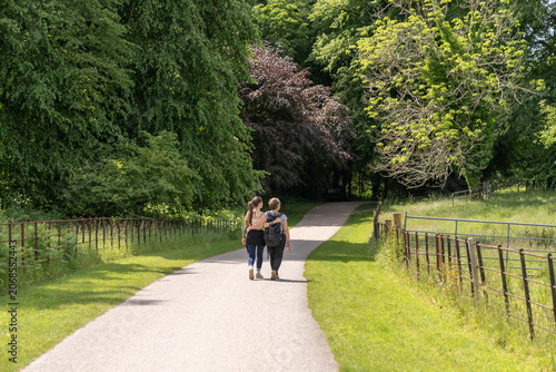 Couple walking on rural path in green countryside