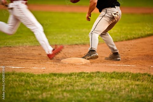 Close up action shot of a baseball player running to first base
