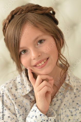 Pretty little girl poses beautifully at home
