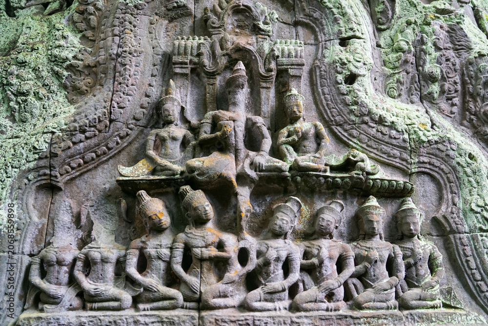 Fototapeta premium Weathered Khmer stone relief carving at Angkor