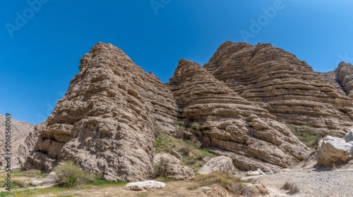 tonalite. Stepped rock layers in a canyon wall, desert landscape. travel magazines, destination branding, wall prints, designed for outdoor magazines and nature guides, used by graphic designers.
