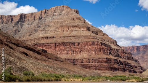 tonalite. Stepped rock layers in a canyon wall, desert landscape. travel magazines, destination branding, wall prints, designed for outdoor magazines and nature guides, used by graphic designers.

