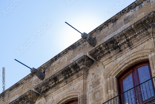 Fotografie Colonial Stone Facade Detail with Balcony and Architectural Corbels in Guadalaja