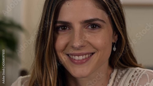 Portrait of a beautiful young woman smiling and looking at the camera