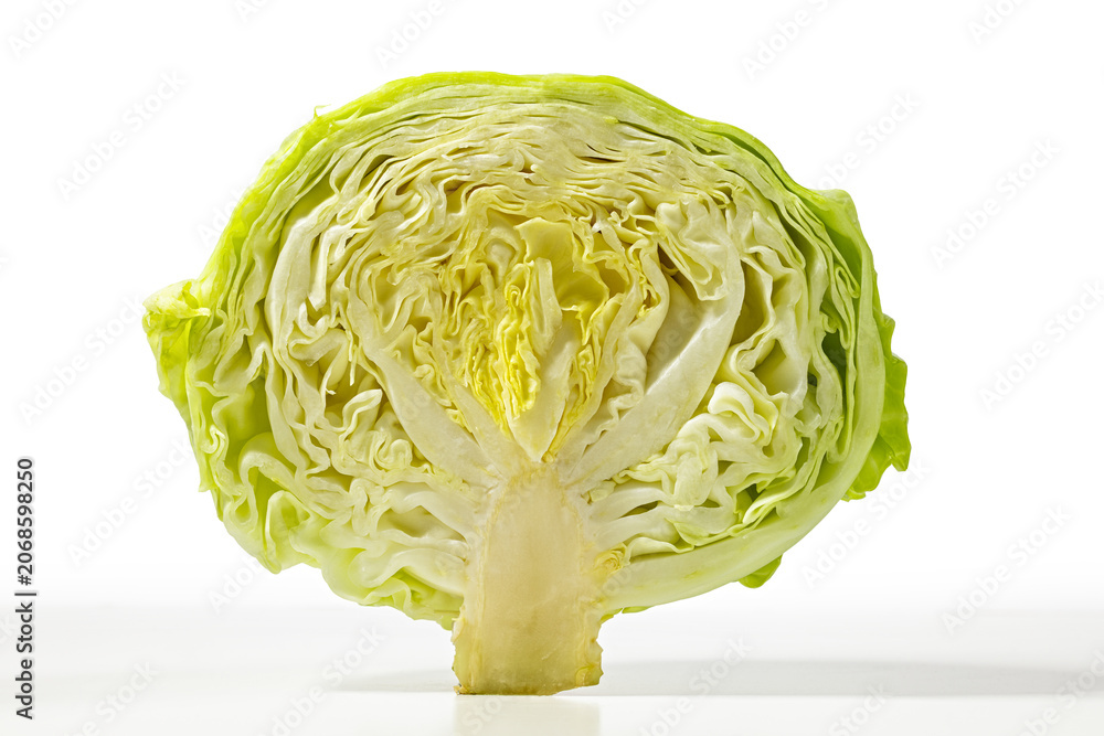Obraz premium Close-Up of Fresh Green Cabbage Cross-Section on White Background for Food Art and Health Concepts