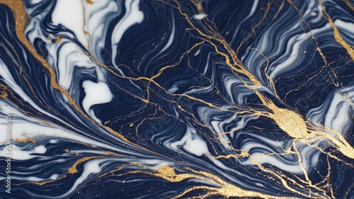 A mesmerizing abstract artwork showcases swirling patterns of deep blue, white, and shimmering gold, resembling marbled stone with intricate veins.