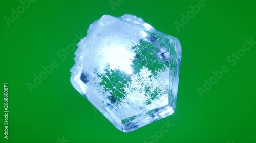 A close-up shot showcases a translucent, icy crystal formation against a vibrant green background, highlighting its intricate structure and frosty details.