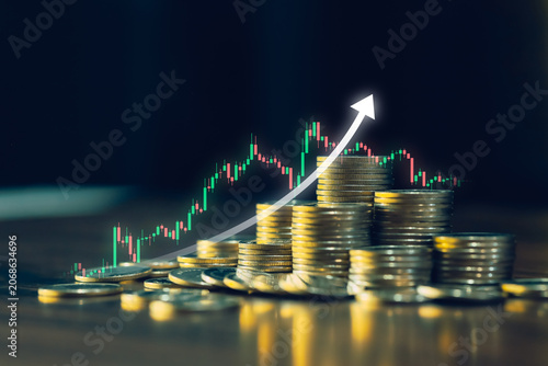 Coin stacks with glowing upward arrow and candlestick chart representing investment growth, stock market gains, financial success, wealth building, strategic planning, and long term profitability.