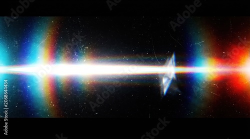 Horizontal anamorphic light leak with chromatic aberration and film grain texture on dark background for cinematic video production and motion graphics.