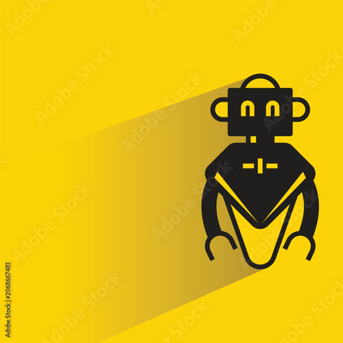 Foto droid robot with shadow on yellow background