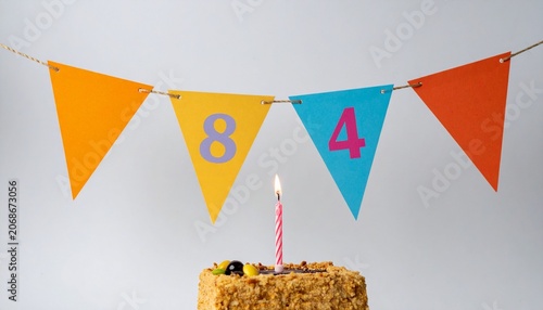 Festive Flag Garland and Cake with Number 84 for Birthday and Anniversary Party