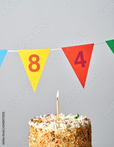 Festive Flag Garland and Cake with Number 84 for Birthday and Anniversary Party