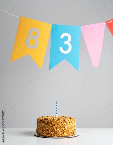 Festive Flag Garland and Cake with Number 83 for Birthday and Anniversary Party