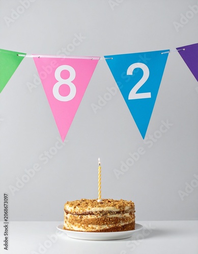 Festive Flag Garland and Cake with Number 82 for Birthday and Anniversary Party