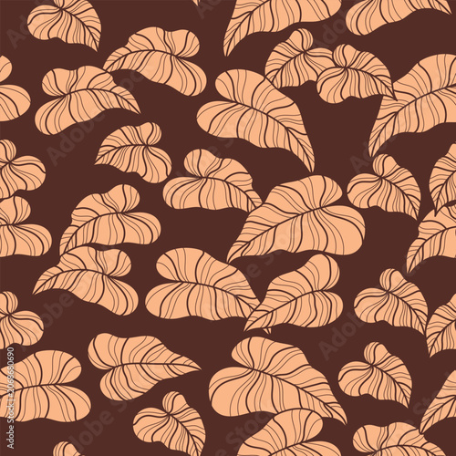 Seamless pattern with tropical leaves on brown background