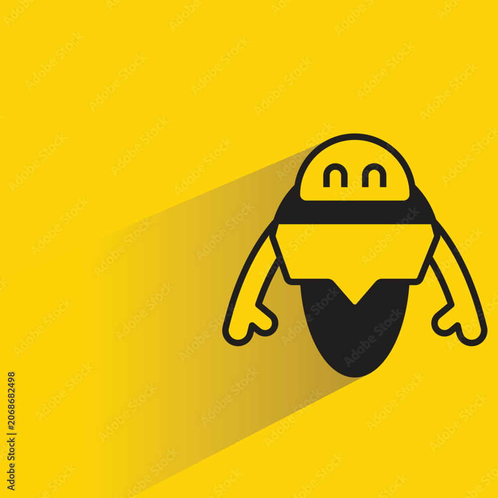 Fotografie droid robot with shadow on yellow background