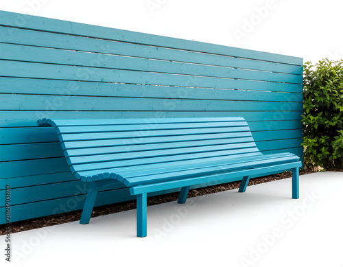 A vibrant blue park bench sits against a matching wooden fence, creating a striking and modern outdoor scene.