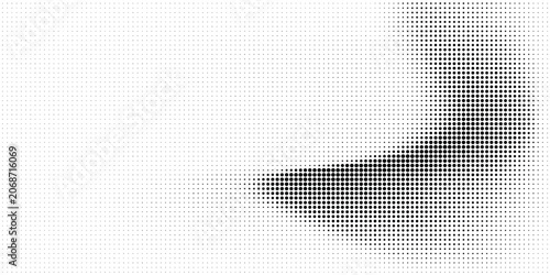 Fotografía Dynamic halftone dot pattern with concentrated dark cluster against a white back